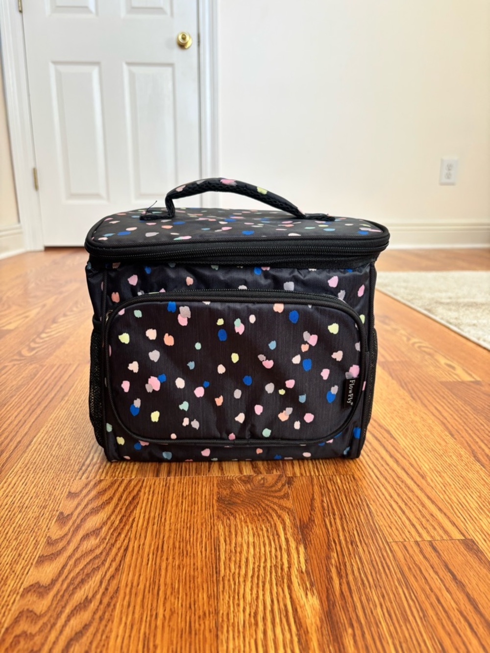 black insulated lunch bag w/ colorful polka dots